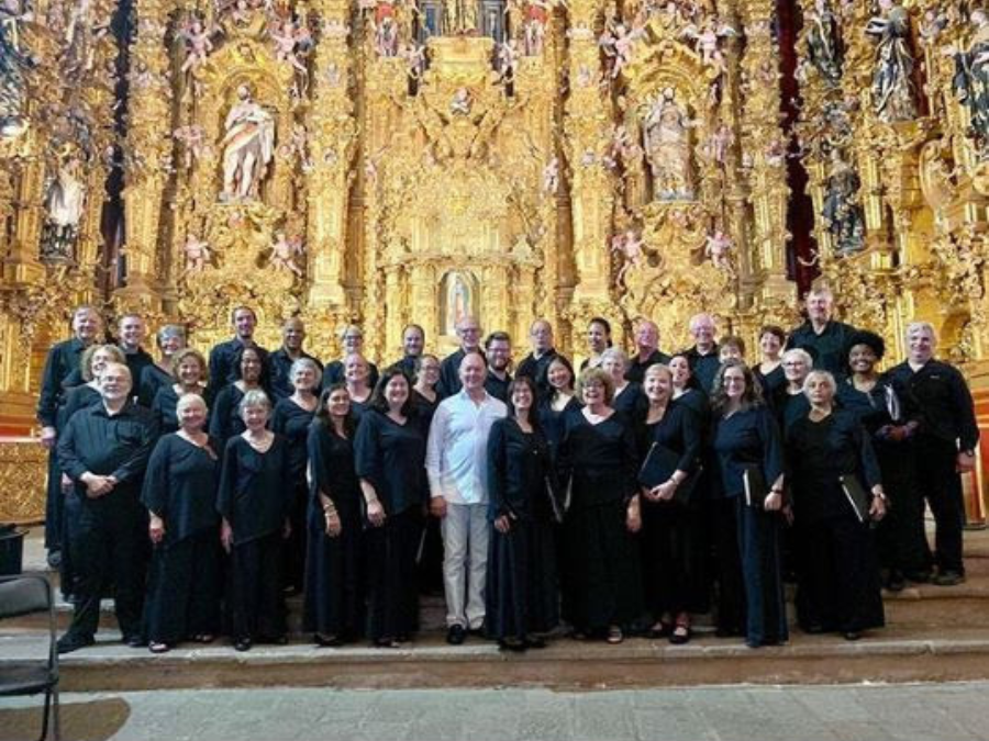 A group of people gathered in an ornate Templo de San Francisco Javier in Tepotzotlan Mexico